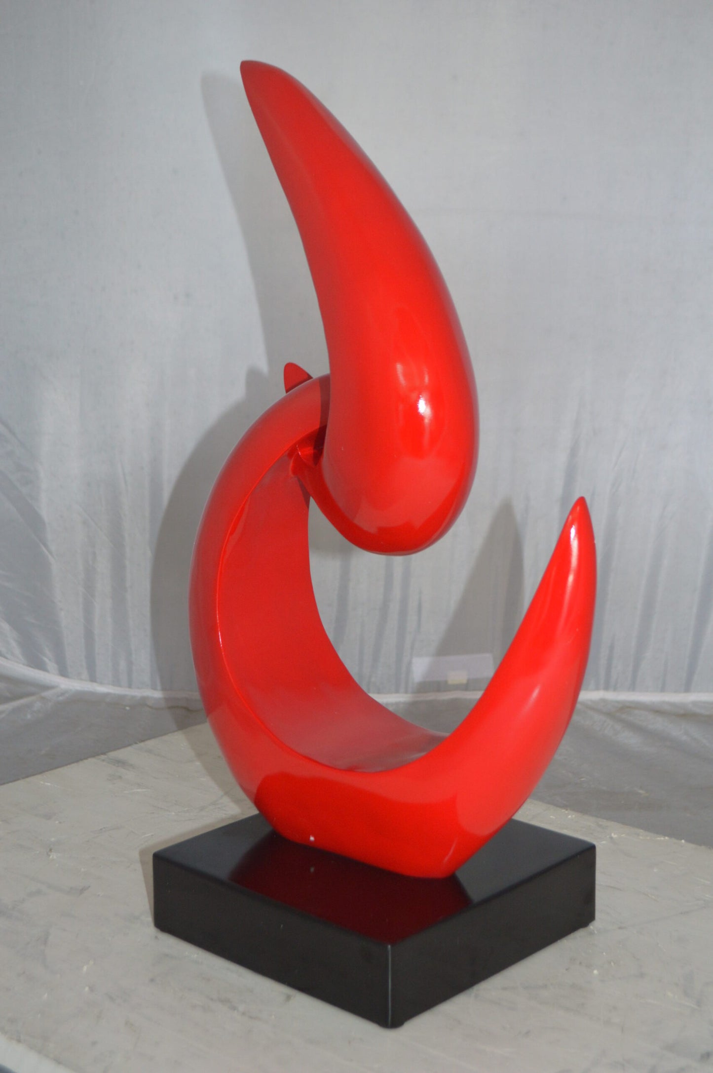 Modern Art Red Boomerang Statue made of Resin -  Size: 13"L x 8"W x 23"H.