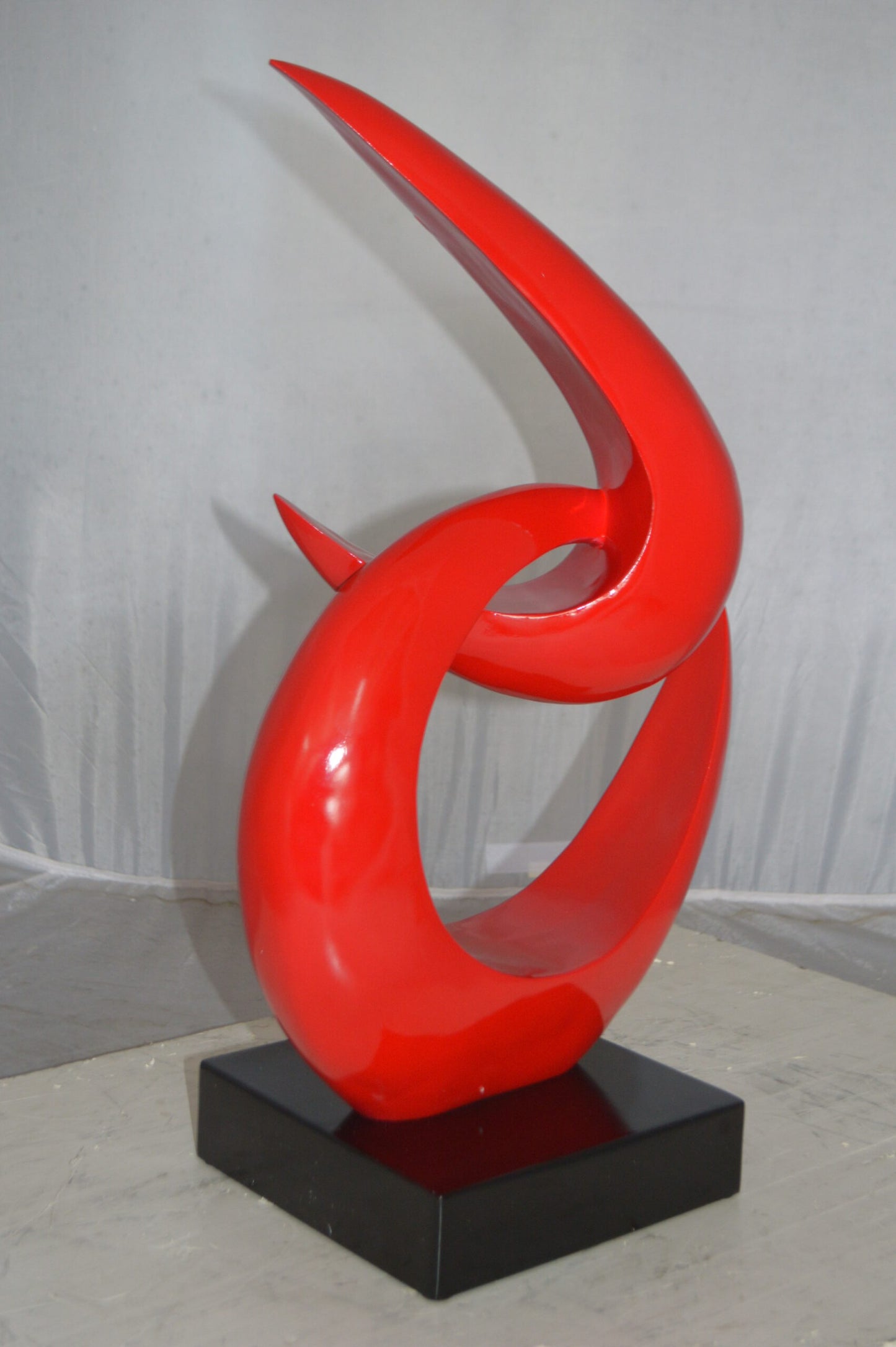 Modern Art Red Boomerang Statue made of Resin -  Size: 13"L x 8"W x 23"H.