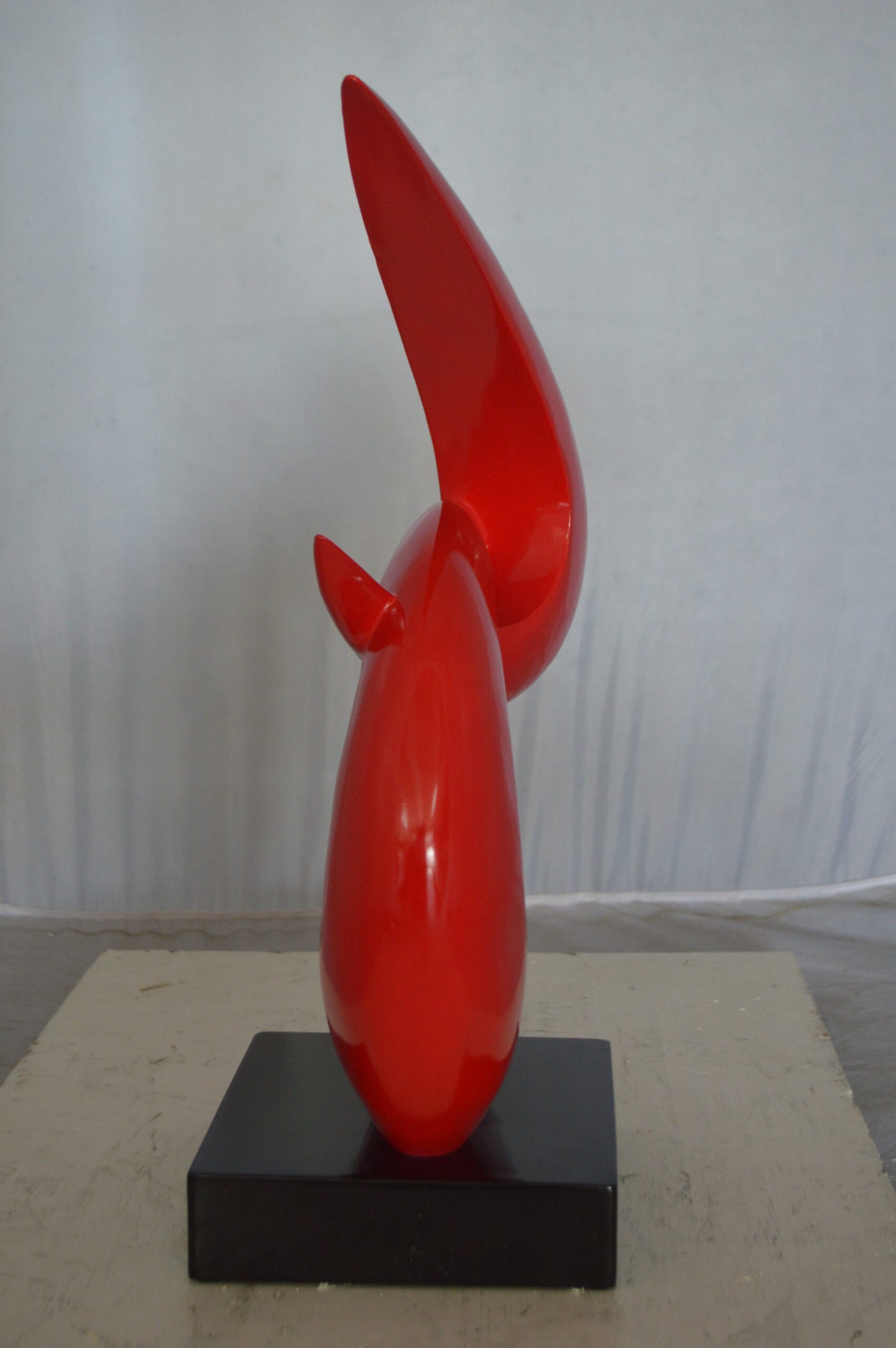 Modern Art Red Boomerang Statue made of Resin -  Size: 13"L x 8"W x 23"H.