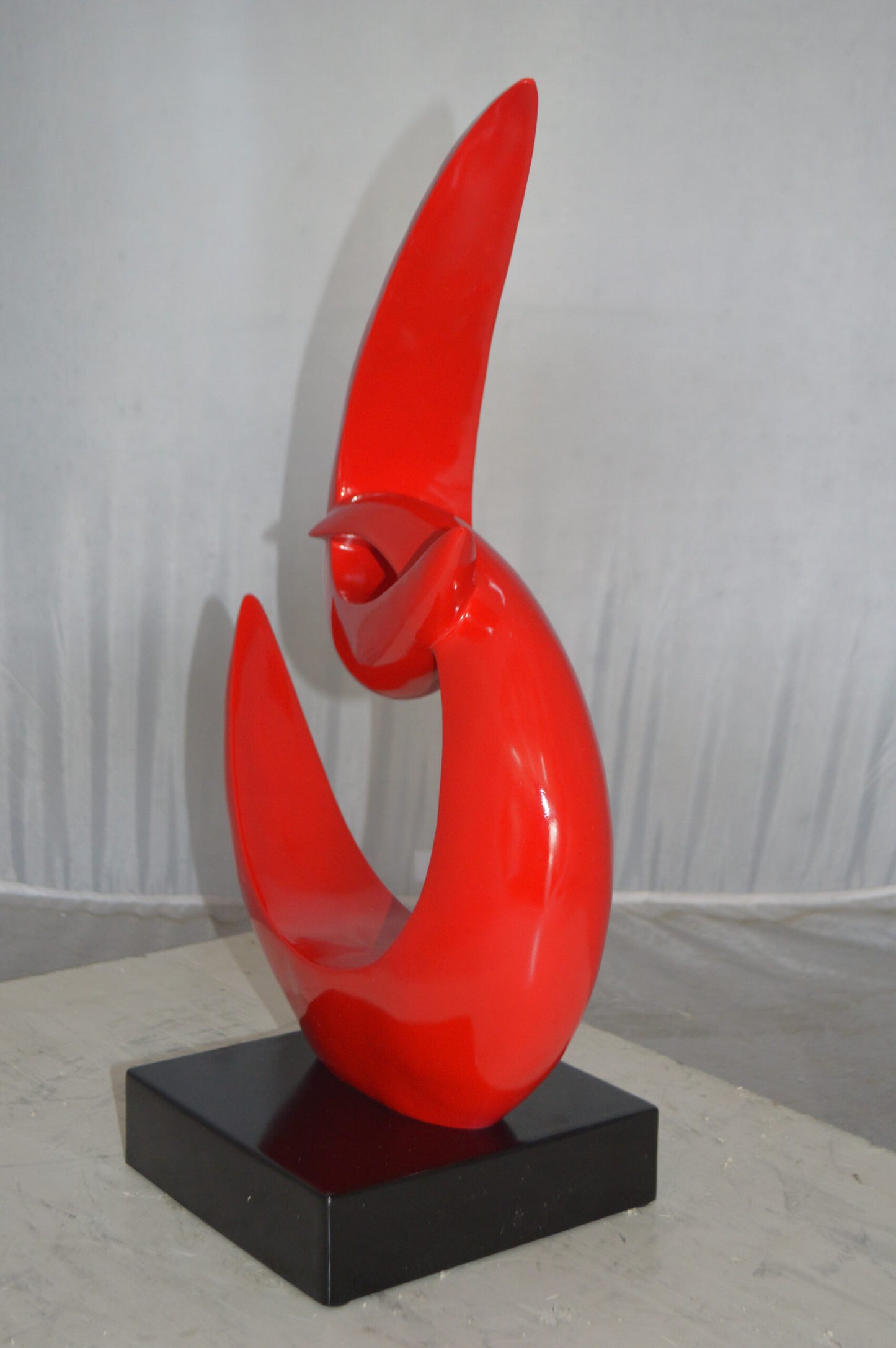 Modern Art Red Boomerang Statue made of Resin -  Size: 13"L x 8"W x 23"H.