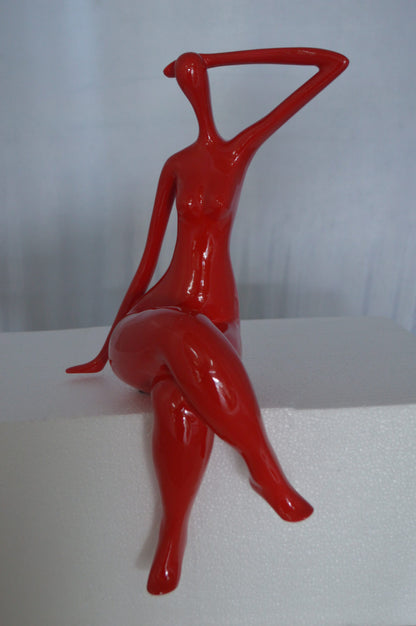Modern Art Sitting on Edge Girl Made of Resin -  Size: 9"L x 7"W x 16"H.