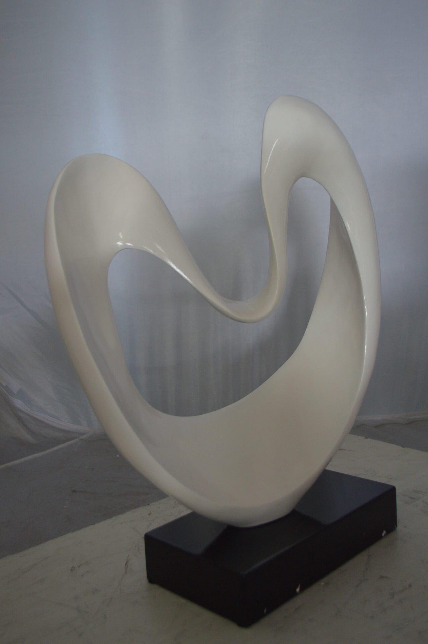 Modern Art White Love Statue Made of Resin -  Size: 19"L x 6"W x 22"H.