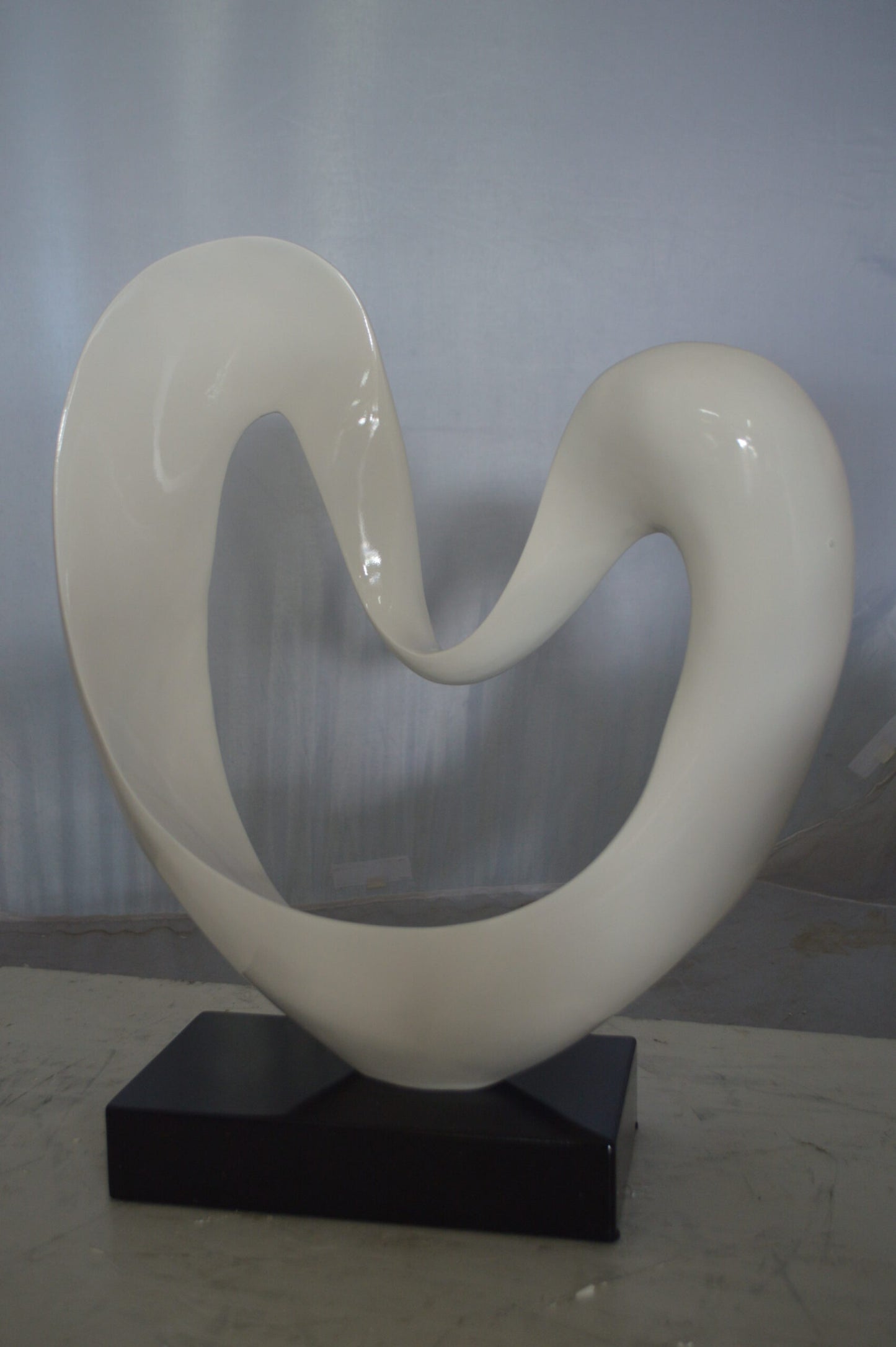 Modern Art White Love Statue Made of Resin -  Size: 19"L x 6"W x 22"H.
