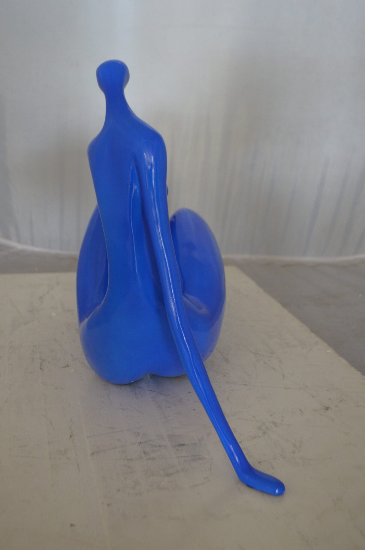 Modern Art Blue Women on the Beach Resin Statue -  Size: 27"L x 8"W x 15"H.