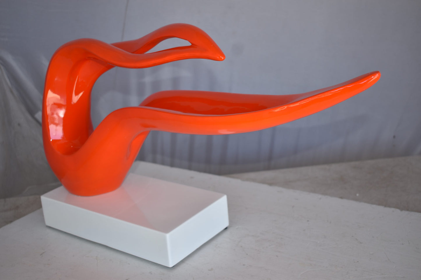 Modern Art Orange Ribbon Resin Statue Mounted on A Base Size: 25" x 6" x 13"H