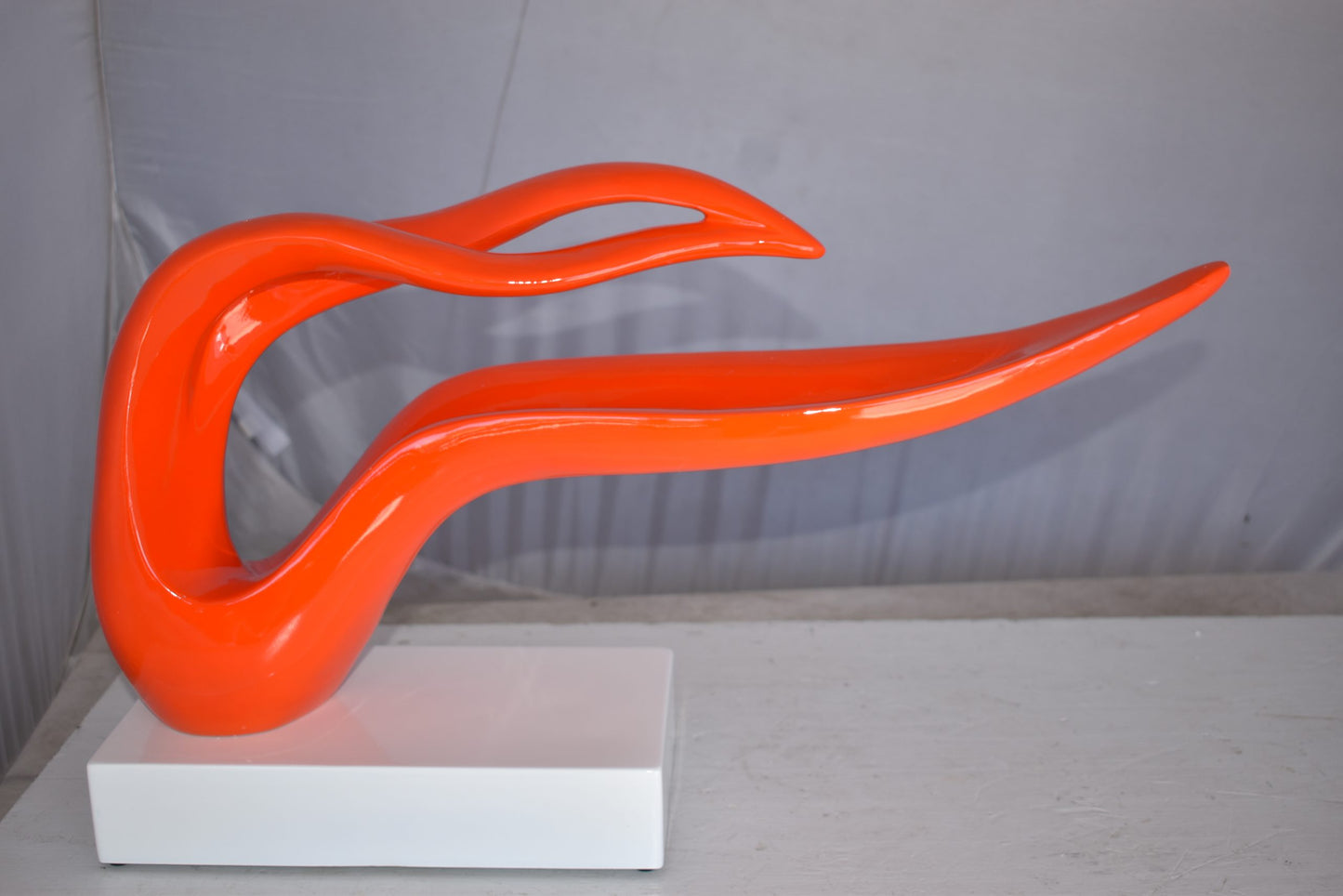 Modern Art Orange Ribbon Resin Statue Mounted on A Base Size: 25" x 6" x 13"H