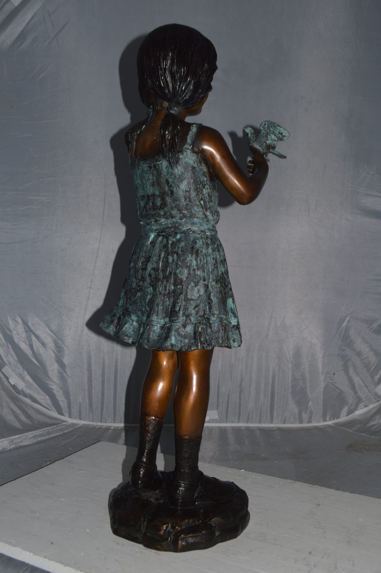 Girl Holding a Bird Bronze Statue -  Size: 12"L x 12"W x 34"H.