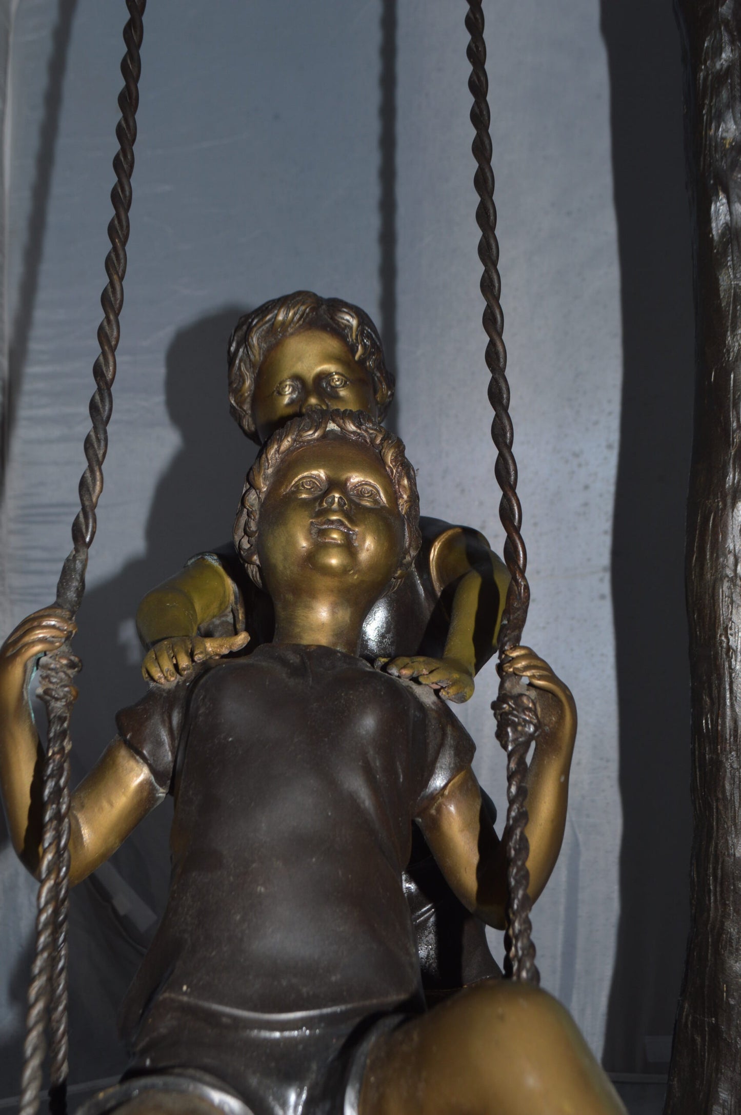 Kids Playing on a Swing bronze Statue -  Size: 22"L x 25"W x 43"H.
