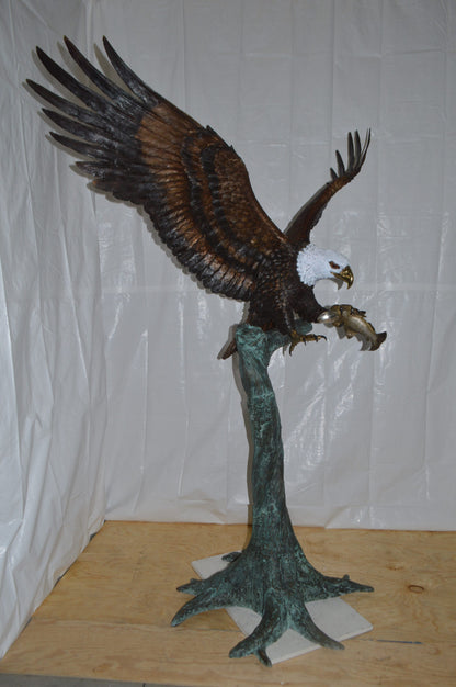 Eagle on a Tree with white face Bronze Statue -  Size: 40"L x 70"W x 90"H.