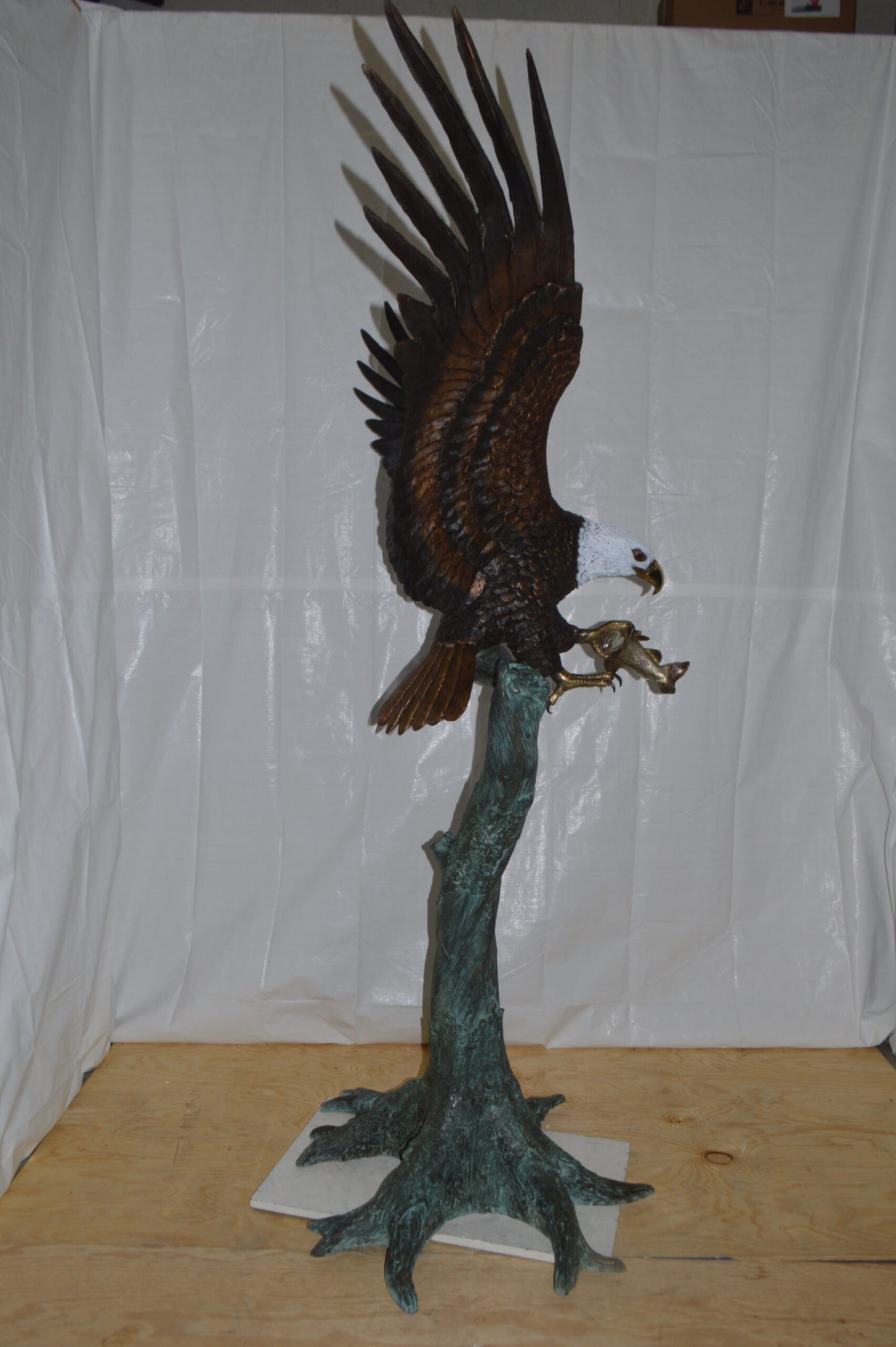 Eagle on a Tree with white face Bronze Statue -  Size: 40"L x 70"W x 90"H.