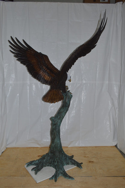 Eagle on a Tree with white face Bronze Statue -  Size: 40"L x 70"W x 90"H.