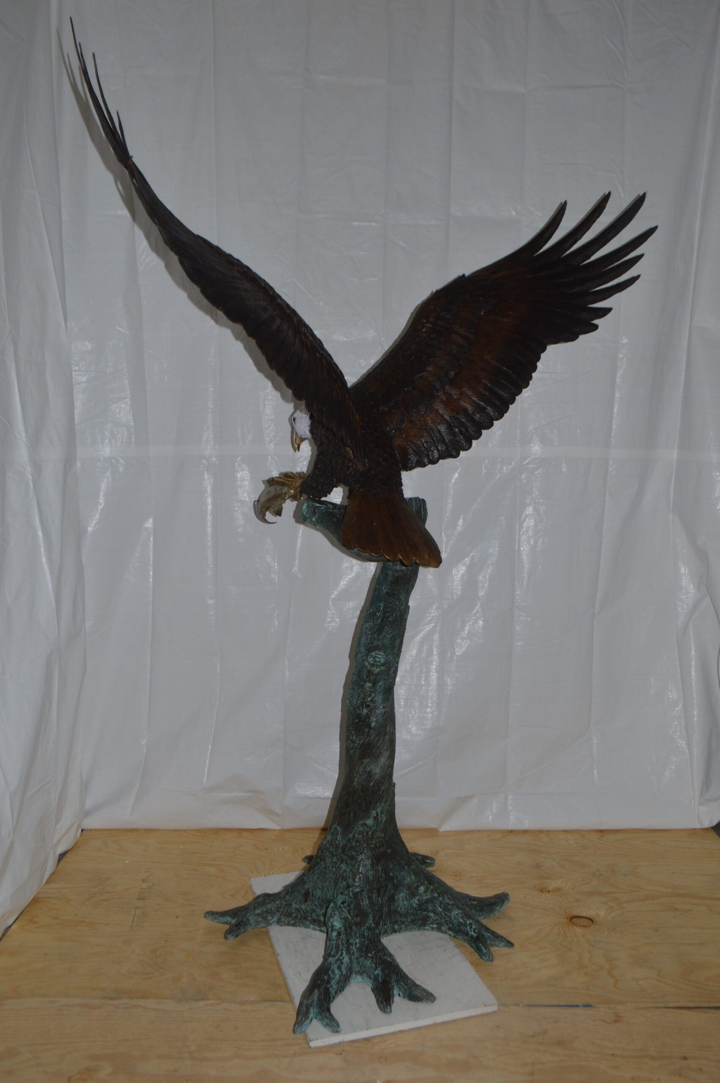 Eagle on a Tree with white face Bronze Statue -  Size: 40"L x 70"W x 90"H.