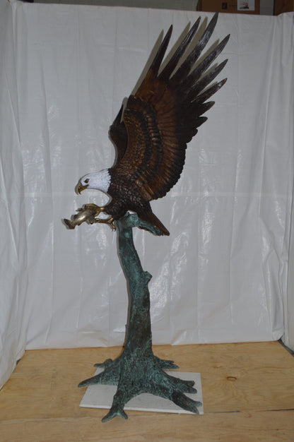 Eagle on a Tree with white face Bronze Statue -  Size: 40"L x 70"W x 90"H.