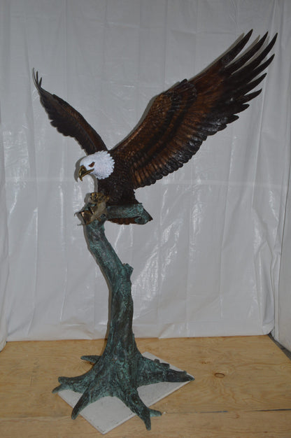 Eagle on a Tree with white face Bronze Statue -  Size: 40"L x 70"W x 90"H.