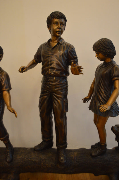 Three Kids With A Dog On A Log Bronze Statue -  Size: 78"L x 26"W x 62"H.