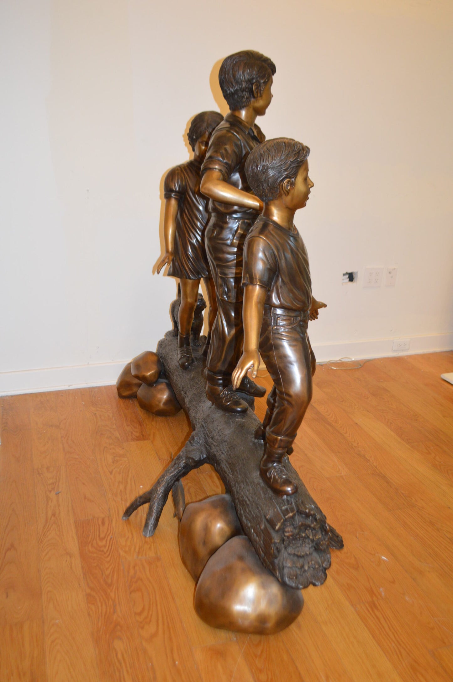 Three Kids With A Dog On A Log Bronze Statue -  Size: 78"L x 26"W x 62"H.