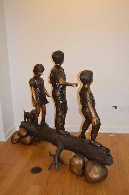 Three Kids With A Dog On A Log Bronze Statue -  Size: 78"L x 26"W x 62"H.