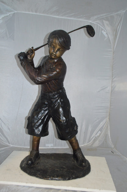 Young Boy Plays Golf Bronze Statue -  Size: 19"L x 21"W x 45"H.