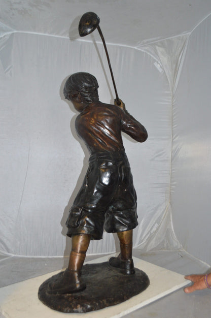 Young Boy Plays Golf Bronze Statue -  Size: 19"L x 21"W x 45"H.