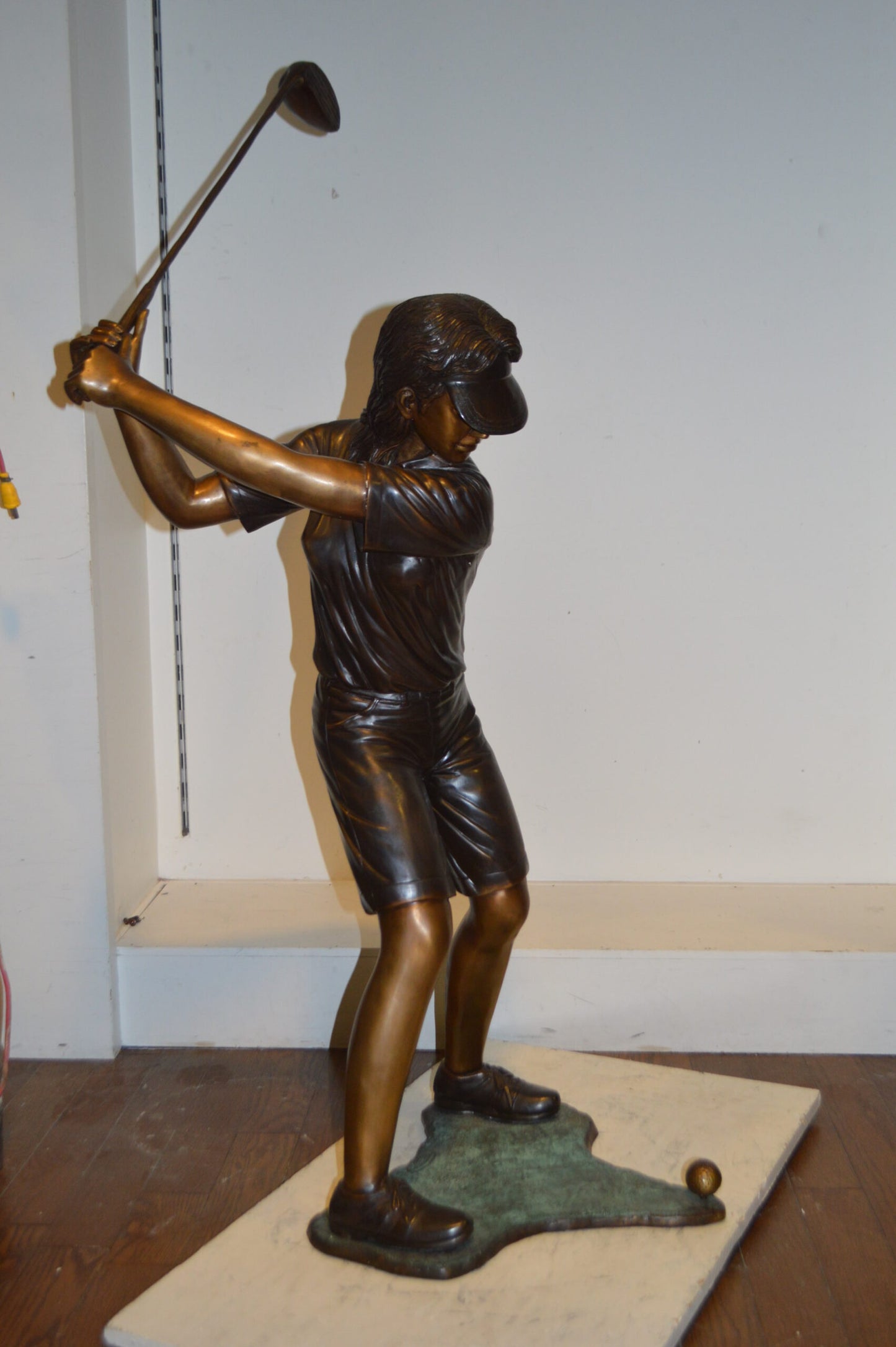 Susan Plays Golf Bronze Statue -  Size: 18"L x 23"W x 47"H.