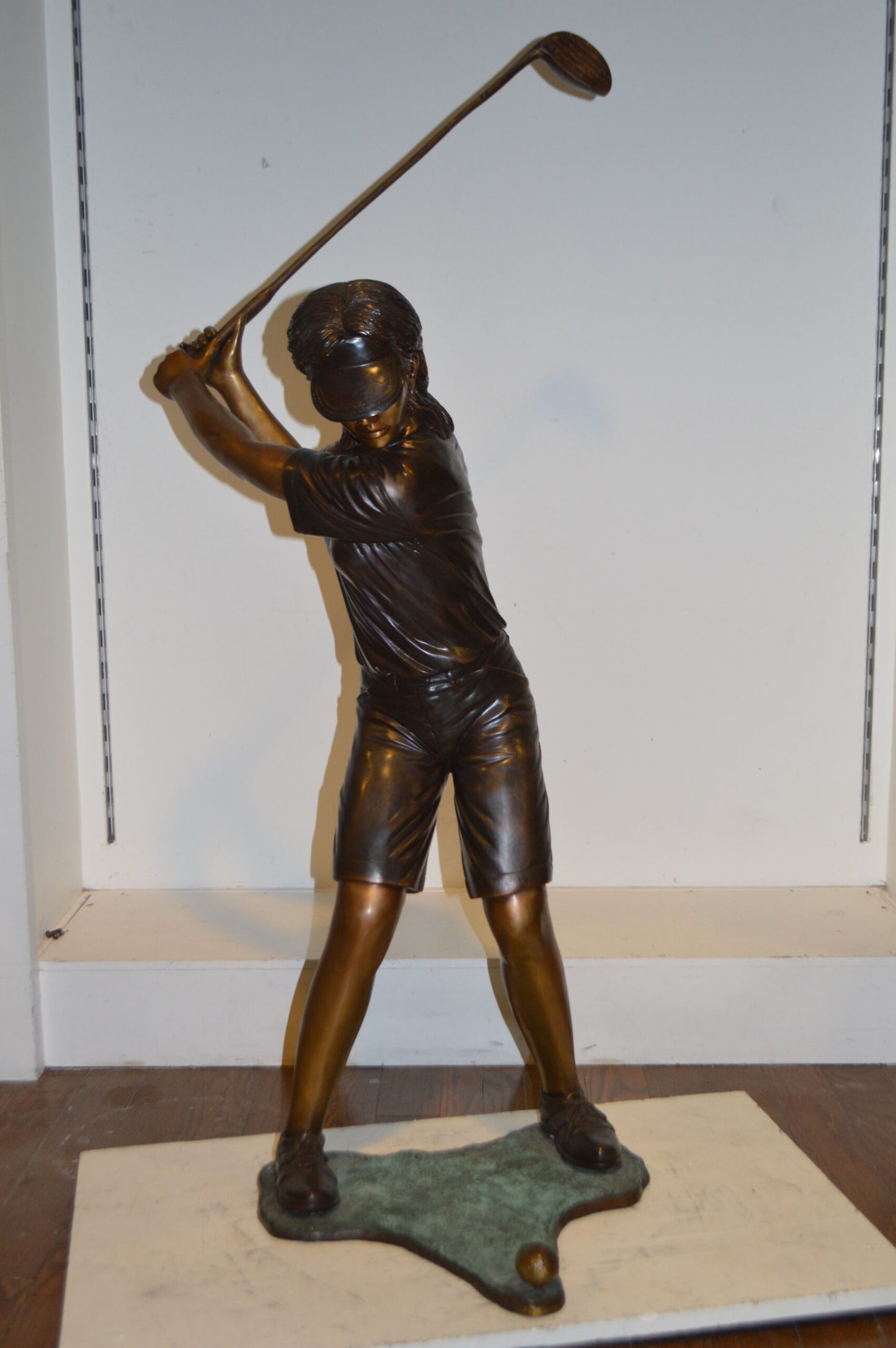 Susan Plays Golf Bronze Statue -  Size: 18"L x 23"W x 47"H.