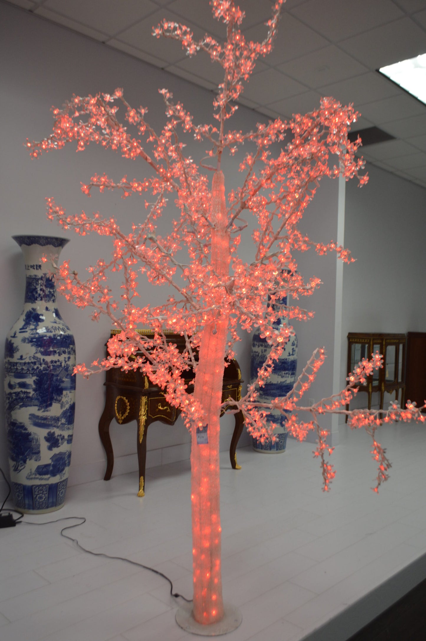 White Tree With Red LED Lights -  Size: 70"L x 65"W x 120"H.