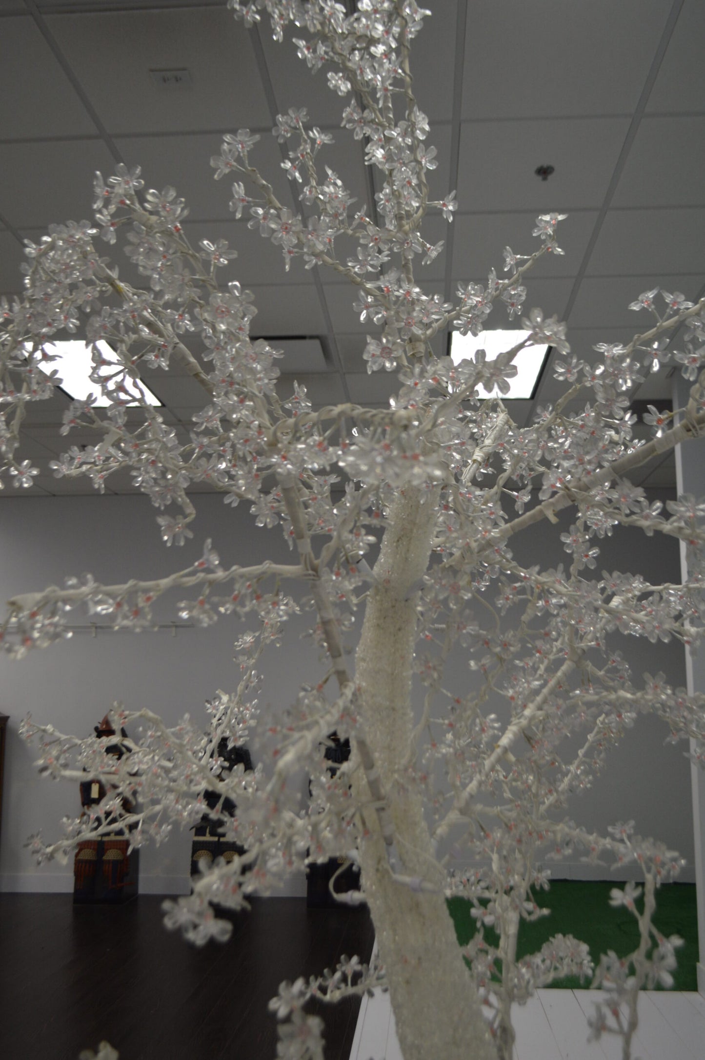 White Tree With Red LED Lights -  Size: 70"L x 65"W x 120"H.