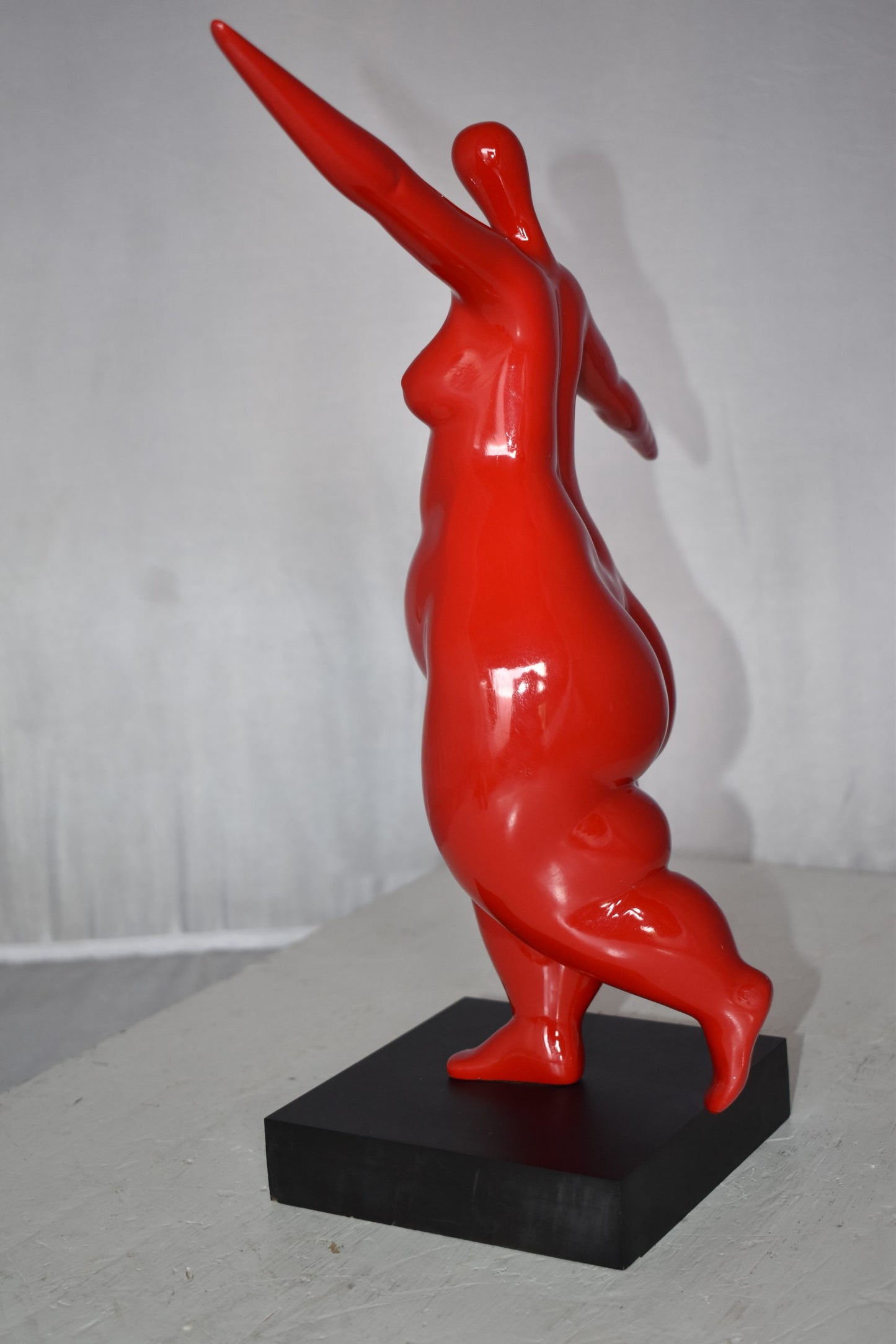 Modern Art Voluptuous Red Lady Hand Up Resin Statue Size: 14" x 5" x 16"H