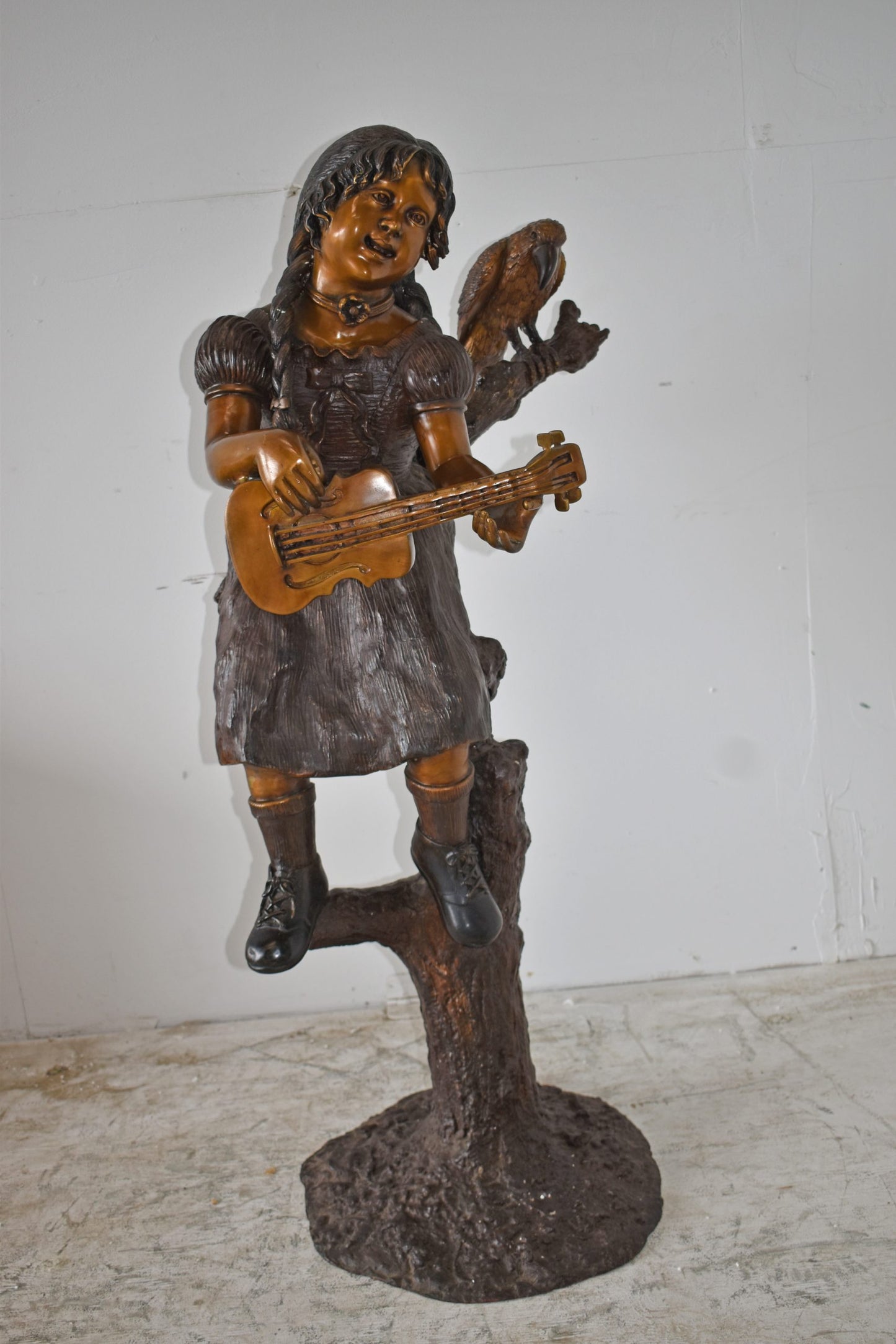 Girl on a Tree Playing the Ukulele with a Parrot Bronze Statue 25" x 23" x 50"H