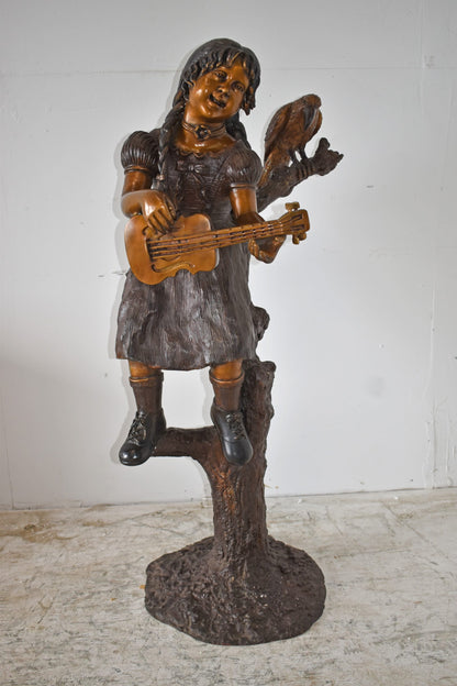 Girl on a Tree Playing the Ukulele with a Parrot Bronze Statue 25" x 23" x 50"H