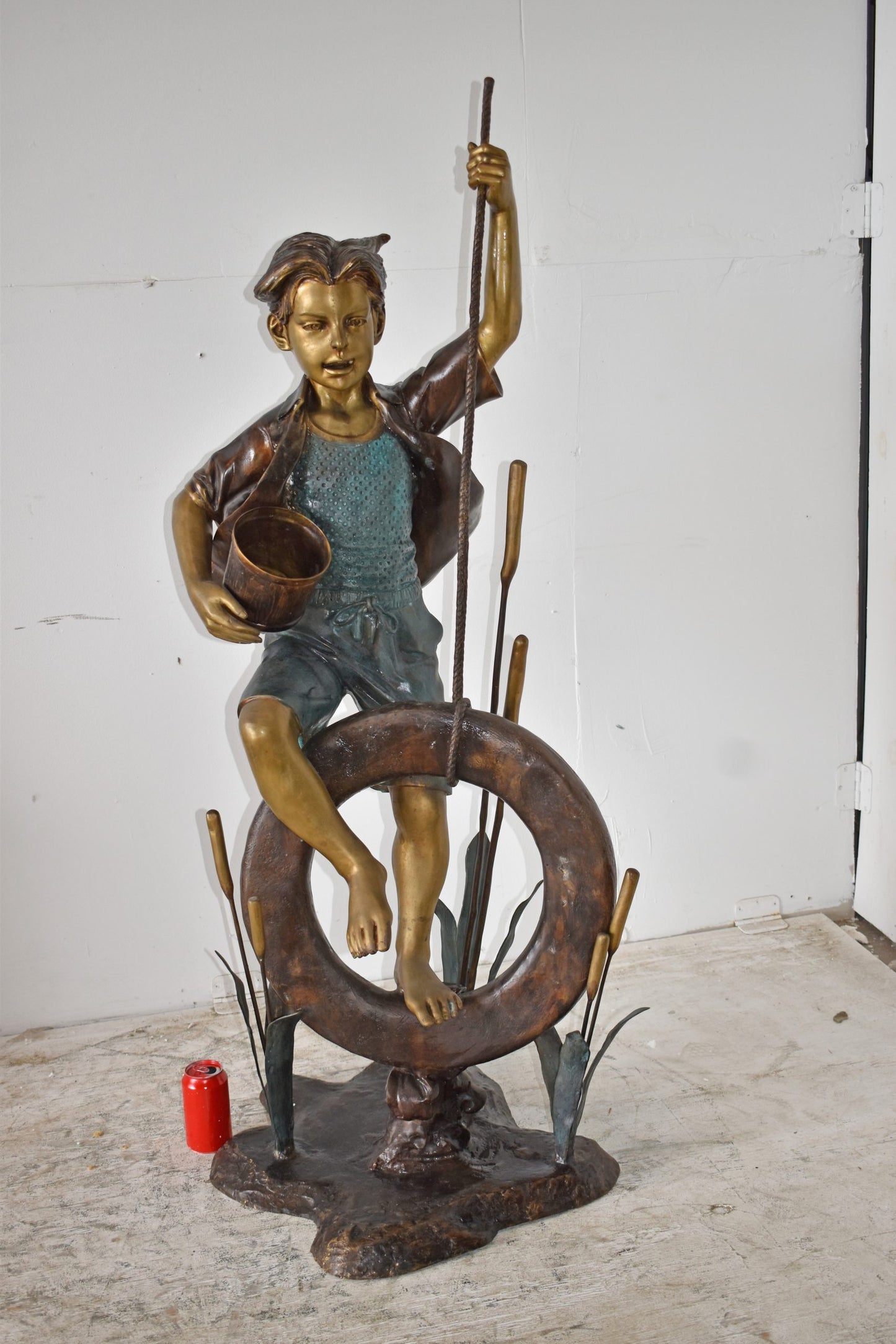 Pirate Sitting on a Life Saver Wheel Bronze Statue Size: 24" x 28" x 57"H