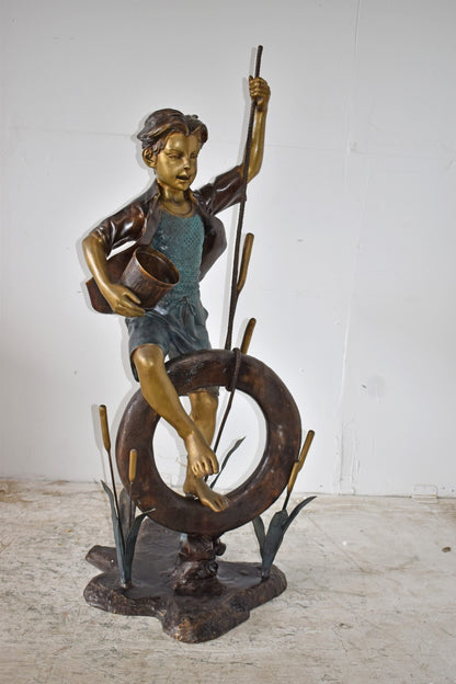 Pirate Sitting on a Life Saver Wheel Bronze Statue Size: 24" x 28" x 57"H