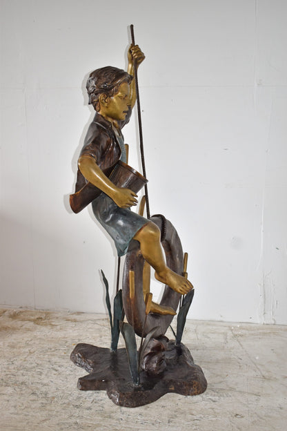 Pirate Sitting on a Life Saver Wheel Bronze Statue Size: 24" x 28" x 57"H