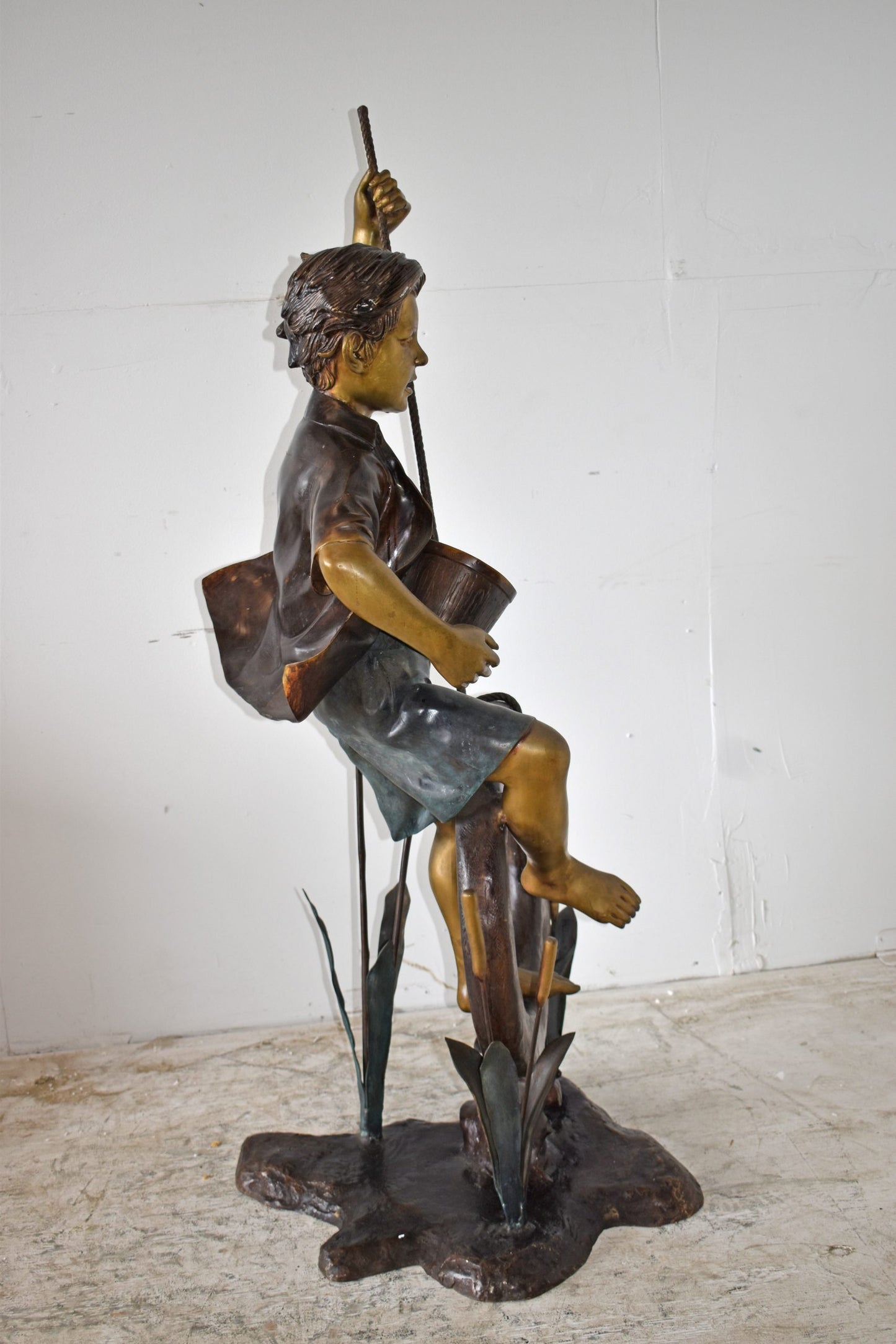 Pirate Sitting on a Life Saver Wheel Bronze Statue Size: 24" x 28" x 57"H