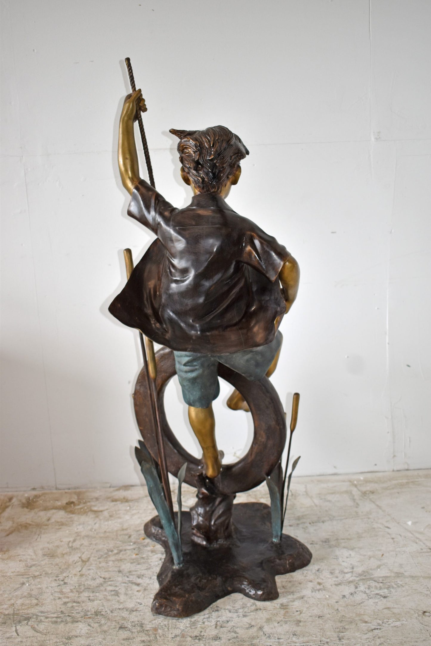 Pirate Sitting on a Life Saver Wheel Bronze Statue Size: 24" x 28" x 57"H