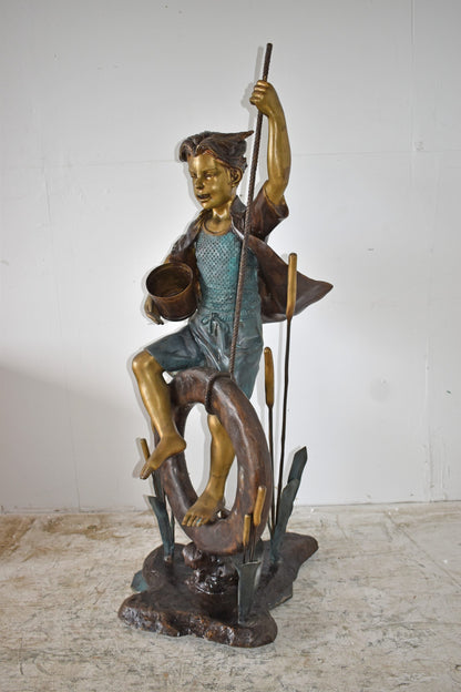 Pirate Sitting on a Life Saver Wheel Bronze Statue Size: 24" x 28" x 57"H