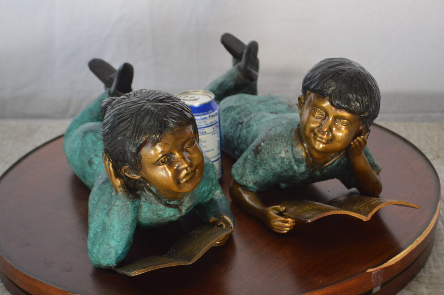 Set of a Boy and a Girl Reading a Book Bronze Statue -  Size: 16"L x 7"W x 8"H.