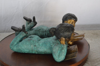 Set of a Boy and a Girl Reading a Book Bronze Statue -  Size: 16"L x 7"W x 8"H.