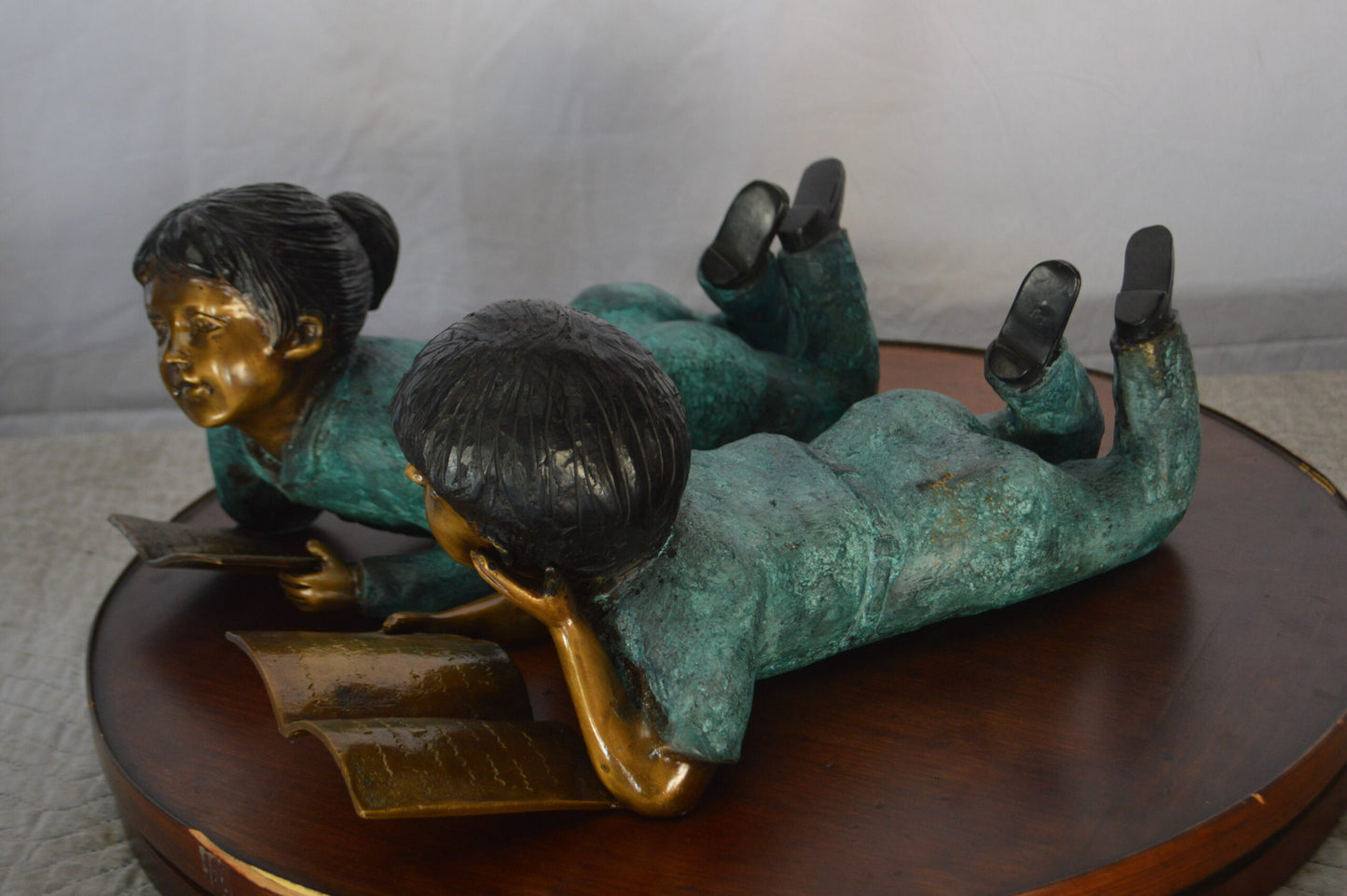 Set of a Boy and a Girl Reading a Book Bronze Statue -  Size: 16"L x 7"W x 8"H.