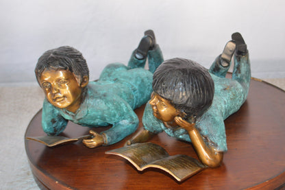 Set of a Boy and a Girl Reading a Book Bronze Statue -  Size: 16"L x 7"W x 8"H.