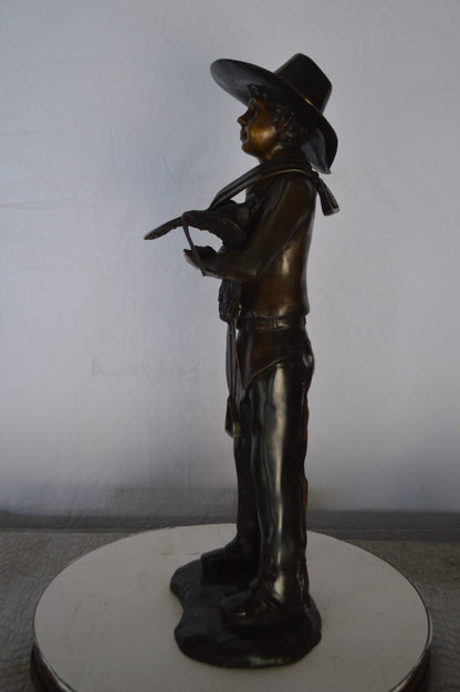 Cowboy Holding a Saddle Bronze Statue  -  Size: 12"L x 11"W x 32"H.