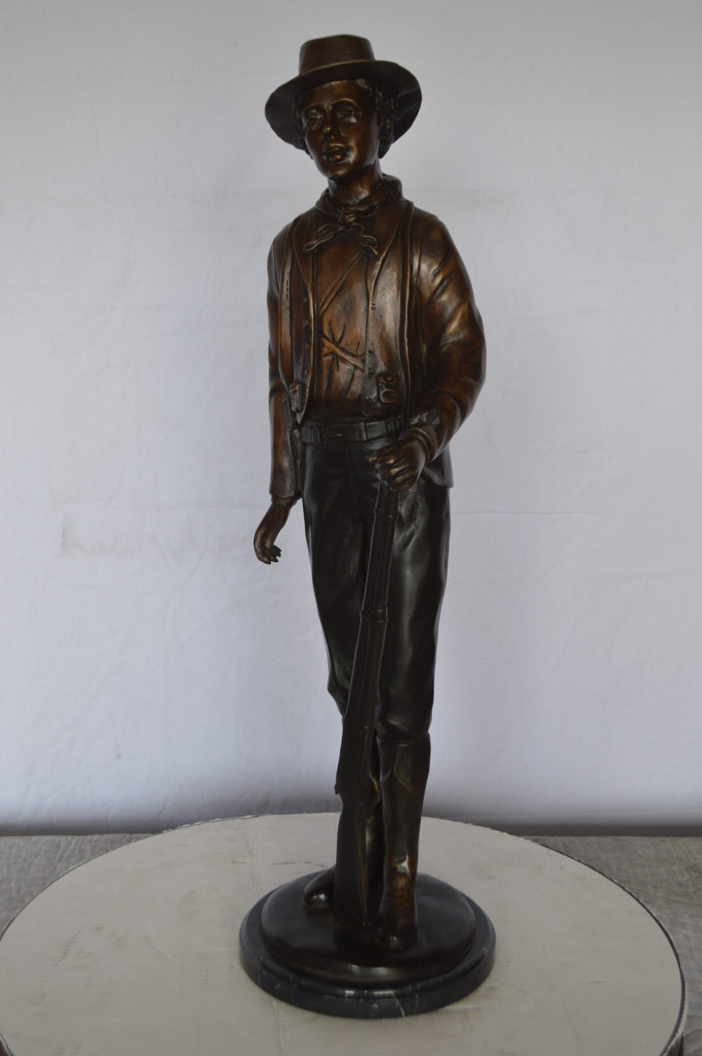 Billy the Kid Bronze Statue mounted on Marble Base -  Size: 11"L x 9"W x 31"H.