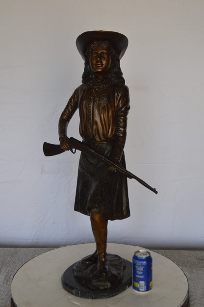Annie Oakley Bronze Statue Mounted on a Marble Base -  Size: 11"L x 9"W x 33"H.