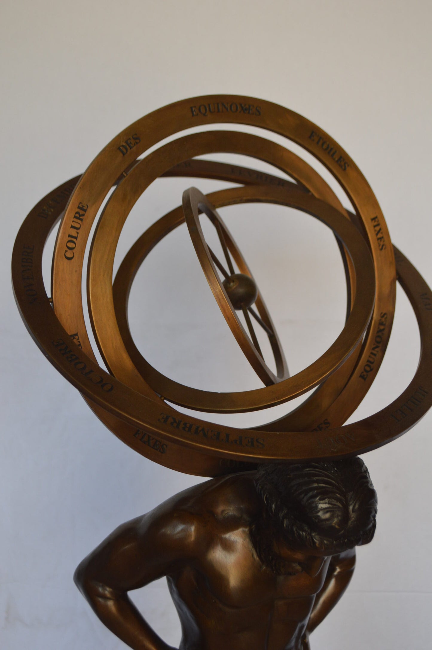 Man with Sundial on his Back Bronze Statue -  Size: 14"L x 12"W x 35"H.