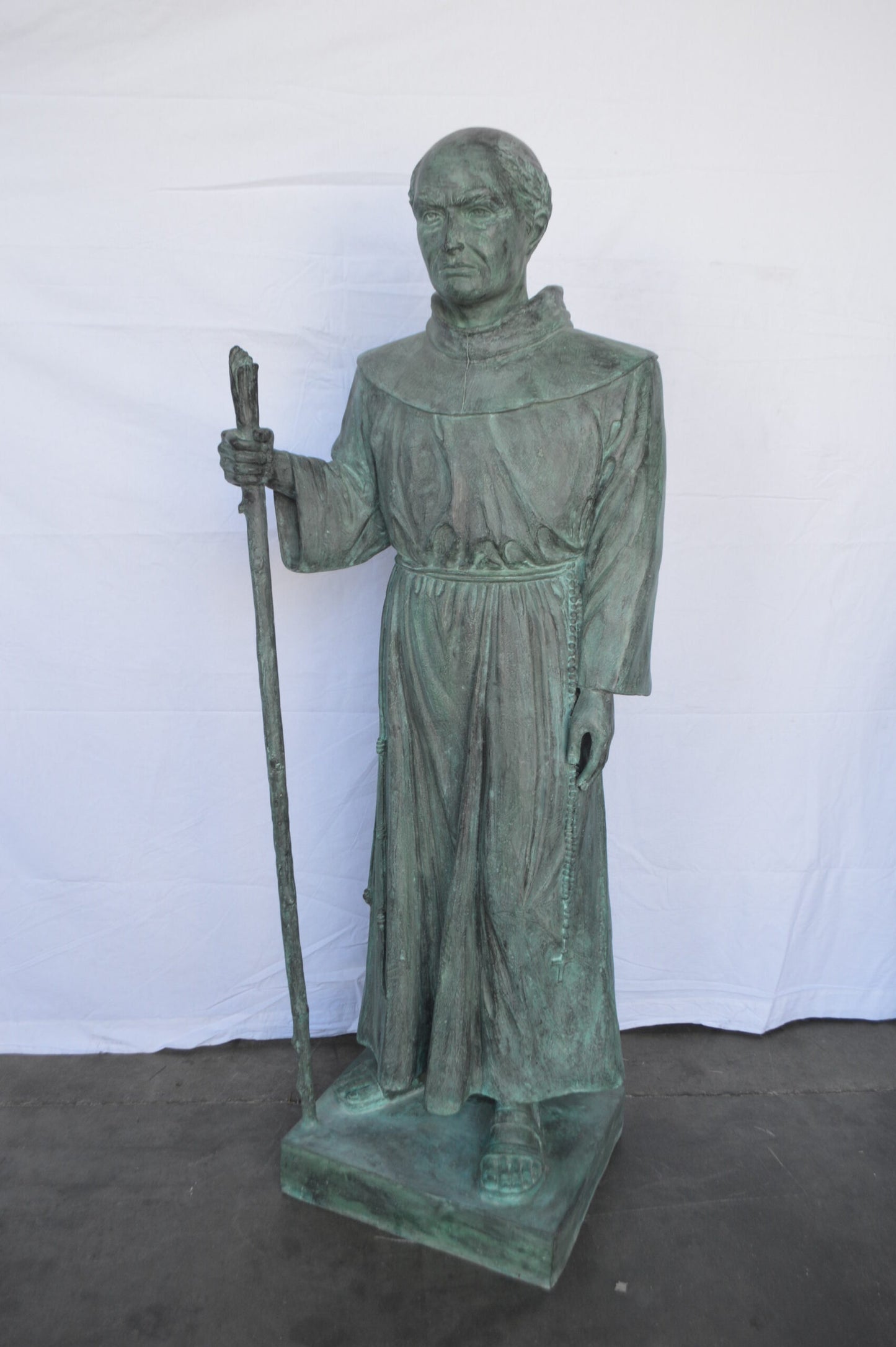 St. Serra Bronze Statue Green Patina -  Size: 22"L x 19"W x 62"H.