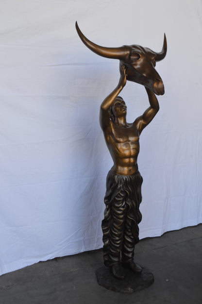Indian Man Holds a Buffalo Skull Bronze Statue -  Size: 29"L x 23"W x 72"H.