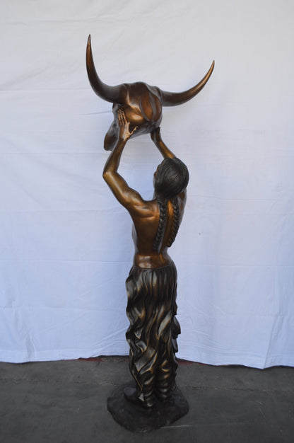 Indian Man Holds a Buffalo Skull Bronze Statue -  Size: 29"L x 23"W x 72"H.