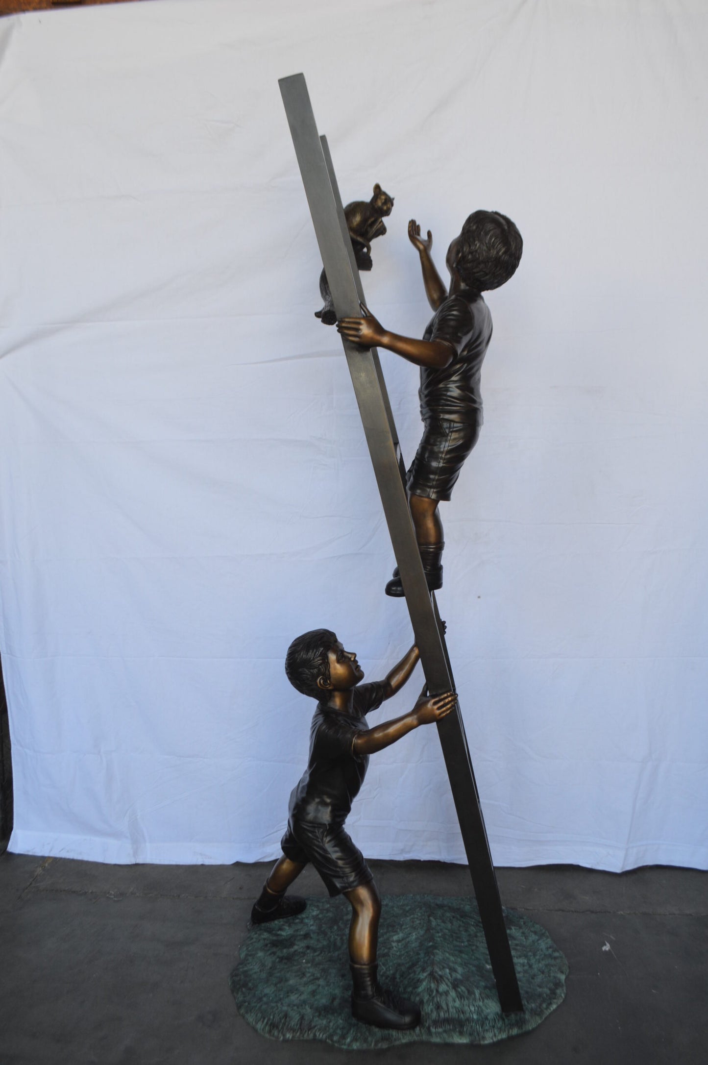 Two Kids Climb a Ladder Saving a Cat Bronze Statue -  Size: 35"L x 24"W x 81"H.