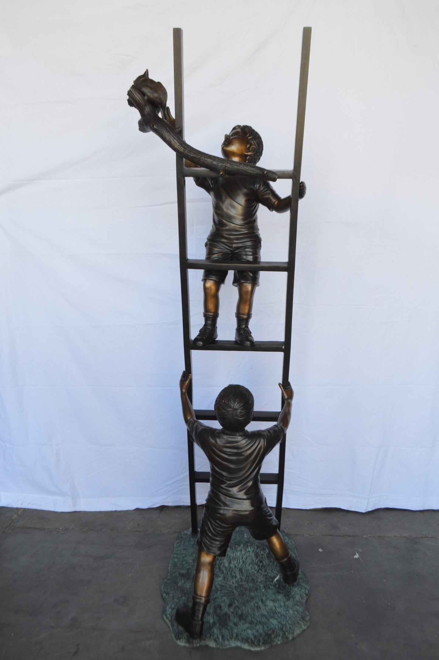 Two Kids Climb a Ladder Saving a Cat Bronze Statue -  Size: 35"L x 24"W x 81"H.