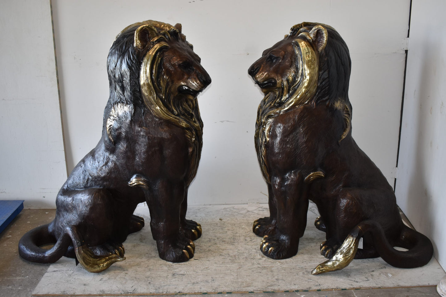 A Pair of Giant Lions with Gold Mane Bronze Statues Size: 36" x 46" x 58"H